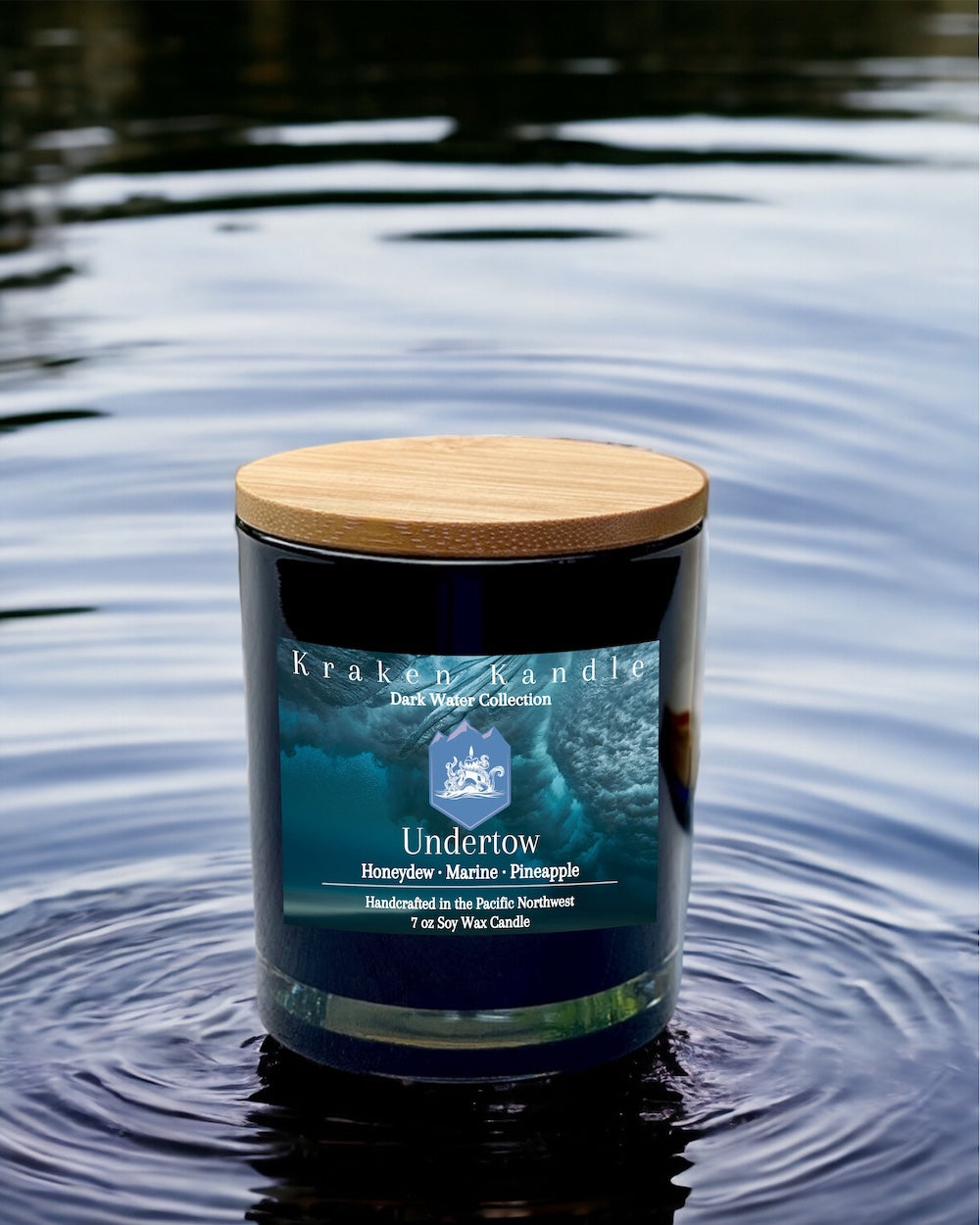 Kraken Kandle Dark Water Collection candle sitting in water 